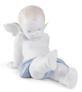 What an angel. Crafted in exquisite porcelain with delicate, muted hues, this baby boy figurine is heaven sent for Lladro collectors.