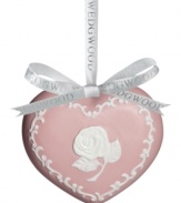 Join the fight against breast cancer with an elegant pink ornament featuring a lovely rose design on one side and a ribbon on the reverse. Keep loved ones affected by the disease in your heart throughout the season.