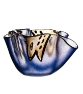 A friendly face peaks in between the folds of midnight-blue glass in this handcrafted Happy Going bowl, a fun surprise for modern interiors. Designed by Ulrica Hydman-Vallien for Kosta Boda.