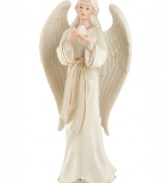 An ethereal angel in porcelain, this lovely figurine brings good tidings to your home with an aura of peace and kindness. From Lenox.