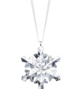 Swarovski makes winter magic with this enchanting little snowflake ornament. Delicate cut crystal sparkles on your tree or clustered in a window, dangling on white satin ribbon.