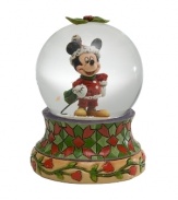 Jim Shore brings his unique folk art-inspired artistry to a beloved American icon in celebration of the holiday season. Holiday Mickey snow globe is sure to charm everyone on your list.