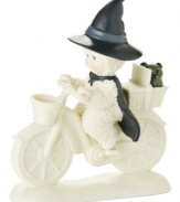 A wickedly cute witch rides west with Toto in tow, pedaling through the land of Oz in this porcelain bisque Snowbabies figurine from Department 56.
