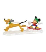 Mush mush, woof woof. Mickey Mouse catches some air on his snowboard as lovable Pluto races through the snow in this adorable Mickey's Village figurine from Department 56.