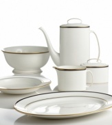 Set the table with poise and purpose. The Library Lane round serving bowl features zesty color combinations that appeal to your inner artist. Round serving bowl shown back left.