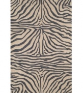 Venture outdoors with this chic area rug, displaying a classic zebra-print design. Hand-hooked of a durable polypropylene-acrylic blend, the Ravella rug can go virtually anywhere! Give some life to your outdoor patio or add some intrigue to your fashion-forward family room.