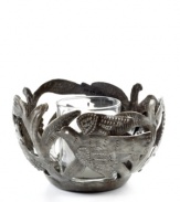 Hand cut and hammered by artist Michaelson, the Fire Bird votive holder accompanies flickering candlelight with intricate birds and branches. Steel from recycled barrels gives each one-of-a-kind piece a rustic beauty perfected by Haiti's esteemed artisans.