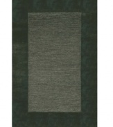 A looped center of mottled tones is framed by rich color in tufted pile, presenting a modern area rug that is both casual and practical. Hand tufted in India of pure wool fibers, the Madrid area rug is a comforting, stylish addition to any decor.