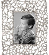 Natural wonder. Organically molded, cast and finished by hand, the Abstract Coral picture frame exemplifies Donna Karan's love of elemental textures. Nickel-plated brass echoes the intricate tendrils of undersea creatures yet perfectly suits modern homes.