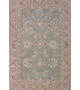 Classic sophistication takes root as flowering vines and elegant palmettes add a touch of tradition to your space. Hand tufted in densely woven polyester and acrylic, this plush area rug from Dalyn will maintain its subtle coloration and rich texture for years to come.