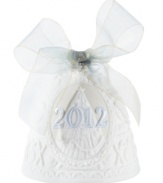 Jingle all the way. Featuring sculpted white porcelain tied up in an ice-blue bow, this handcrafted bell ornament by Lladro makes your Christmas tree sing year after year.