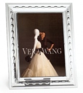 A sensuous blend of vintage-inspired frills create beautiful depth in this frame. In high-luster silverplate, this elegant home accent is fit for framing all your finest memories.
