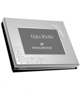 Featuring a brilliant silver-plated cover with raised floral accents, the Vera Lace Bouquet guest book from Vera Wang Wedgwood invites family and friends to write words of wisdom and best wishes.