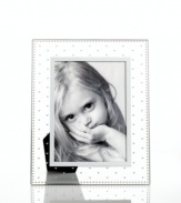 Dotted with hearts, the Sweethearts picture frame is simultaneously classic and cute in clear glass. A special gift to give and to get from Martha Stewart Collection.