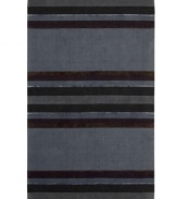 Linear designs are accented with exotic faux silk to create a timeless palette in the Sahara area rug from Calvin Klein. Crafted by skilled artisans in India, it features generously thick wool and viscose fibers woven to create remarkable strength and impeccable elegance.