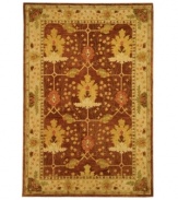 Savor the natural landscape. This sublime rug from the Anatolia collection features deep color, rich texture and a nature-inspired tableau. A latticework pattern overlaying the earth-toned palette and graceful botanic shapes recalls the serene experience of gazing through a window. Hand-tufted of fine wool and dyed using an ancient pot dying technique.