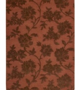 Those with a rosy outlook will embrace the elegant floral motif of this Nourison rug. Hand-tufted from premium-quality wool and meticulously hand-carved for a lush dimensional effect, every detail of this alluring area rug comes together to create a bold focal point in any setting.