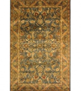 A special herbal wash gives Safavieh's Antiquity rug its aged patina and irresistibly lustrous finish. A plumed floral motif adorns this hand-tufted rug in a shimmering blue and warm gold palette, accenting your home with classic elegance. (Clearance)