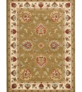 Bring the brilliance of ancient Persian textile design home with the green and ivory Lyndhurst area rug from Safavieh. Crafted from soft polypropylene, this rug radiates timeless allure with the added convenience of easy-care construction. (Clearance)