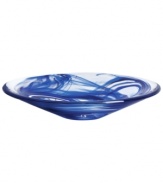 A dramatic accent, the Tempera Blue dish features heavy glass laced with hand-painted swirls of deep blue. Designed by Anna Ehrner for Kosta Boda.