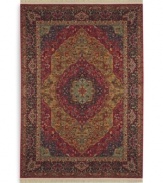 Inspired by the distinctive and beautiful textiles of the Kirman region in ancient Persia, this rug features a curvilinear medallion design upon a field embellished with arabesques and floral motifs. Patterned after a nineteenth-century Kirman rug, it makes use of borders to showcase a spectrum of colors such as indigo blue, brick reds, tobacco golds, browns and olives - with a smattering of soft aqua, coral and burgundy. Each color is specially dyed for a timeworn striated effect that recreates the antique beauty of the original. Woven in the USA of luxuriously soft premium worsted New Zealand wool.