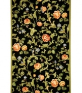 Midnight in the garden. The rich, black surface of this bewitching rug from Safavieh provides a dramatic backdrop for the leafy plumes, salmon-colored blossoms and delicate violets woven in. Handmade for superior detail, this elegant rug belongs in any room where taste is paramount. Woven of virgin wool with a durable cotton backing. (Clearance)
