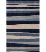 A bold, striped pattern fashioned in rich shades of blue and beige creates a captivating look that integrates beautifully with any transitional or contemporary decor. Rife with lush texture and detail, this luxurious area rug from Dalyn is beautifully hand tufted in polyester and acrylic, ensuring superior color retention and long-lasting wear.