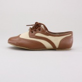 Add a classic design to her your wardrobe with these two-toned ballet shoes.