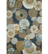Mod-inspired blooms and pinwheel shapes twirl across this Promenade area rug, imparting vivacious character. Denim and sky blues mix for a fresh, aquatic effect. UV-stabilized polypropylene/acrylic blend offers the look of natural fibers but resists fading and wear, making this rug perfect for any indoor/outdoor area in need of a style boost.