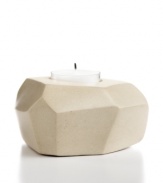 Set the mood in stone. Chiseled and sanded by hand, no two candle holders are exactly alike but each is beautifully crafted in Haitian soapstone. A modern shape and organic feel make it a unique home accent – and a great gift!