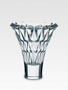 A beautiful crystal vase is handcrafted with a smooth base and diamond-cut facets along the wide, open neck. From the Tornado Collection Full-lead crystal 10 high Hand wash Made in France 