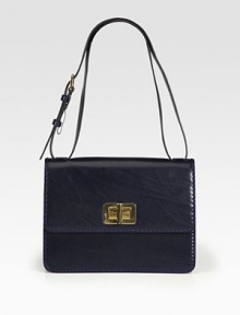 Butter-smooth leather takes on a lady-like silhouette in this gorgeous flap design finished with polished turnlock hardware.Adjustable shoulder strap, 9½-11¾ dropTurnlock flap closureOne outside open pocketOne inside zip pocketThree inner compartmentsLeather lining11W X 8H X 3½DMade in Italy