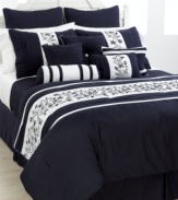 Navy blue, in bloom. Delicate floral embroidery embellishes a sophisticated palette of navy and white for a classic look perfect in any season. Boasting five unique decorative pillows and coordinating coverlet, this set has all the details you need to create a decorator look in minutes. (Clearance)
