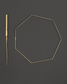 Slim, geometric 14K yellow gold hoop earrings by Lana.