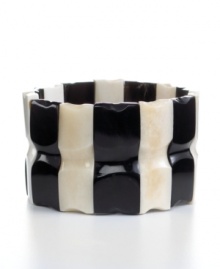 Cow horn turned chic. Handcrafted by talented Haitian artisans, this beaded stretch bracelet brings bold, organic style and new meaning to your jewelry collection in an alternating light and dark design. Cow horn turned chic. Handcrafted by talented Haitian artisans, this beaded stretch bracelet brings bold, organic style and new meaning to your jewelry collection in an alternating light and dark design.