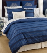 Classic comfort meets modern styling. This Westerly Stripe duvet cover set from Tommy Hilfiger features a landscape of blue stripes that reverse to a navy background with an ivory dot circle pattern. Button closure.