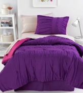 Anything but ordinary, this Marrakesh Market comforter set offers a distinct Moroccan feel with expert ruched texture and metallic stitched details for luxe glimmer. A rich purple hue finishes this trendy look. Reverses to solid pink.