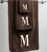 Dry off in your signature style with monogrammed towels from Avanti. Embroidered with a single capital letter in Bodoni font, this mocha and ivory towel set makes it easy to personalize your bath.