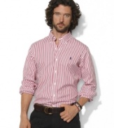 A polished stripe motif adds timeless style to a trim-fitting sport shirt in crisp cotton poplin.