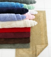 Pick a color, any color! This gorgeous rug will coordinate beautifully with any bathroom. In a heavy weight pile for superb absorbency and a plush feel. Finished with a tonal textured border. (Clearance)