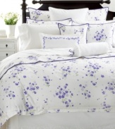 A delicate border of violets frames this crisp white cotton Martha Stewart Collection decorative pillow with charm and elegance.