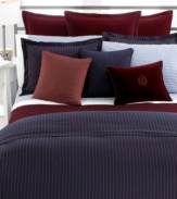 Woven of pure cotton in a chic navy hue with chalk stripes, the Greenwich Modern comforter from Lauren Ralph Lauren lends sophistication to any bedroom.