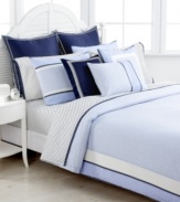 Tommy Hilfiger's European sham features white polka dots on a navy background, contrasting perfectly with the coordinating sheets sets. Finished with a navy and white striped border. Hidden zipper closure.