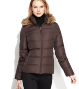Calvin Klein's puffer features classic styling and a fitted, feminine touch. A zip-off hood trimmed in faux fur adds the finishing touch.