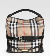 A perfect slouchy shape for all of your essential items, crafted in the classic canvas Burberry check with sleek leather trim. Leather top handle, 3 dropDetachable leather shoulder strap, 9½ dropOne inside zip compartmentOne inside zip pocketCotton lining10W X 12H X 5DMade in Italy