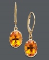 Add a burst of sunshine to your look. Earrings feature vibrant oval-cut citrine (3-1/5 ct. t.w.) set in 14k gold. Approximate drop: 1 inch.