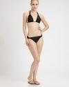 Triangle cups, sleek fabrication and gold hardware give this design a sexy-chic look.Halter strap ties at neckBack tie closure84% polyamide/16% elastaneFully linedHand washImported Please note: Bikini bottom sold separately. 