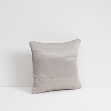 Dramatic in it's simplicity Grande Dame takes it's inspiration from a classic French damask design. It's Grande scale and clean lines make it sophisticated and modern. A subtle stripe ground softens the Sterling satin while a mélange texture brings interest to the motifs.