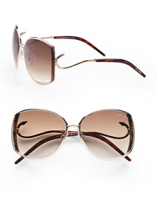 This sleek design boasts a ridged metal frame with hook detailed temples for a truely unique look. Available in shiny rose gold/havana with brown gradient lens. Hook detailed temples100% UV protectionMade in Italy 