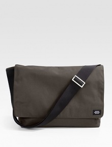 A handsome carry-all for the classroom and the office alike, perfect for your laptop in rugged nylon canvas. Flap Velcro® closure Headphone audio port Front zip pockets Back slip pocket Interior zip and organizing pockets Laptop envelope Adjustable shoulder straps 18W X 11½H X 5½D Imported